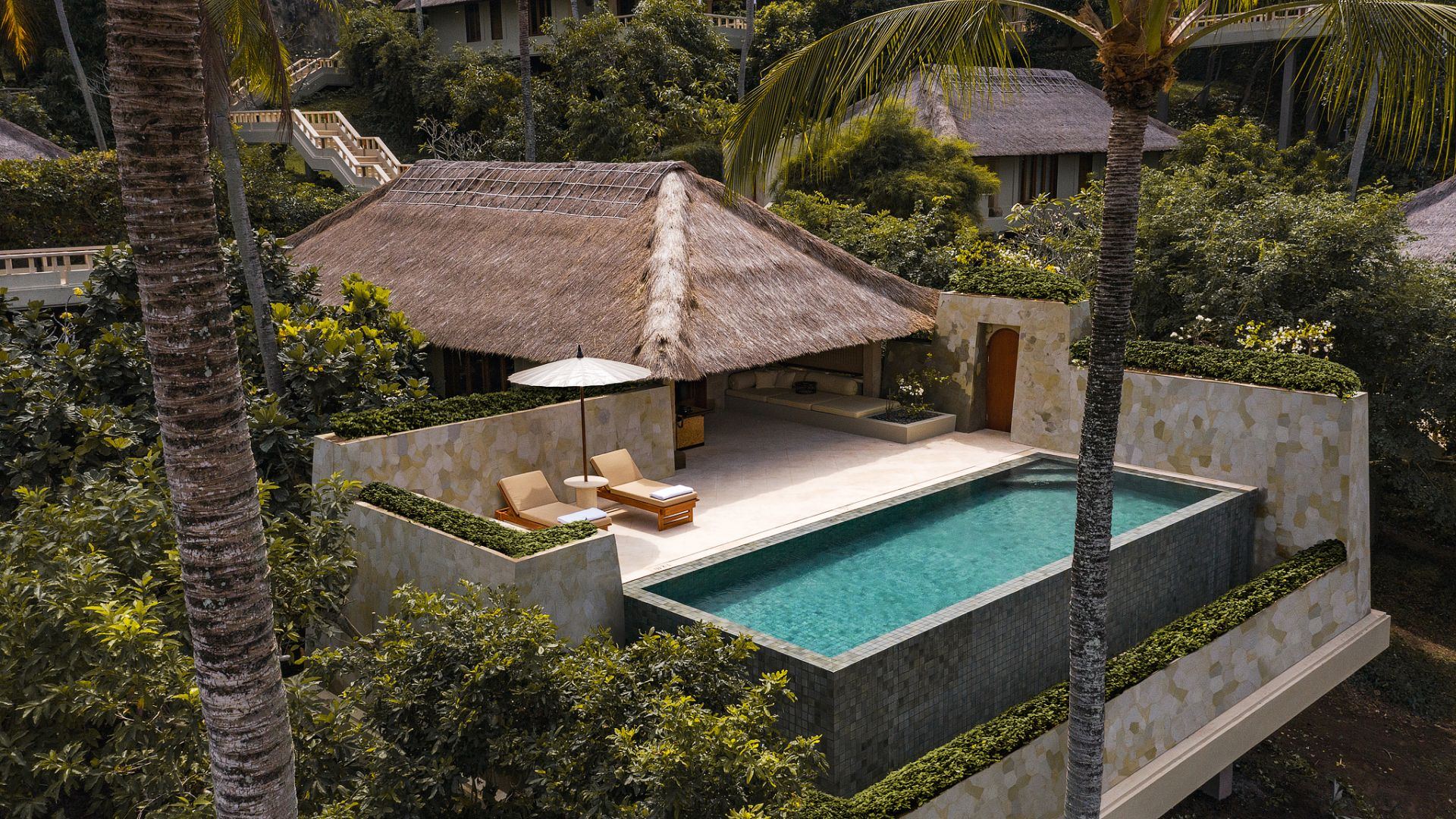 Aerial view of one of Amankila's private pool suites, tucked into the jungle with its own plunge pool