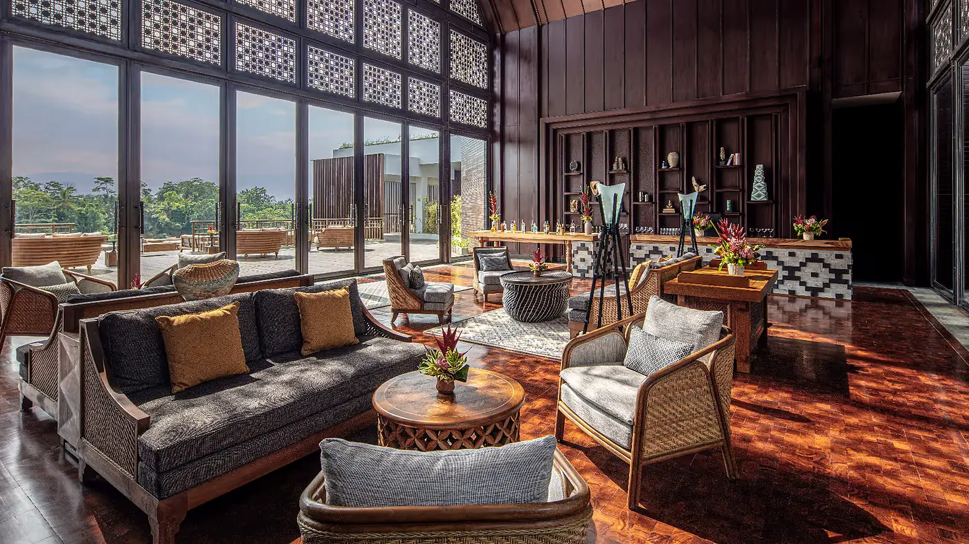 One of the two bars at Anantara Ubud, dark wood panelling and a view over the valley