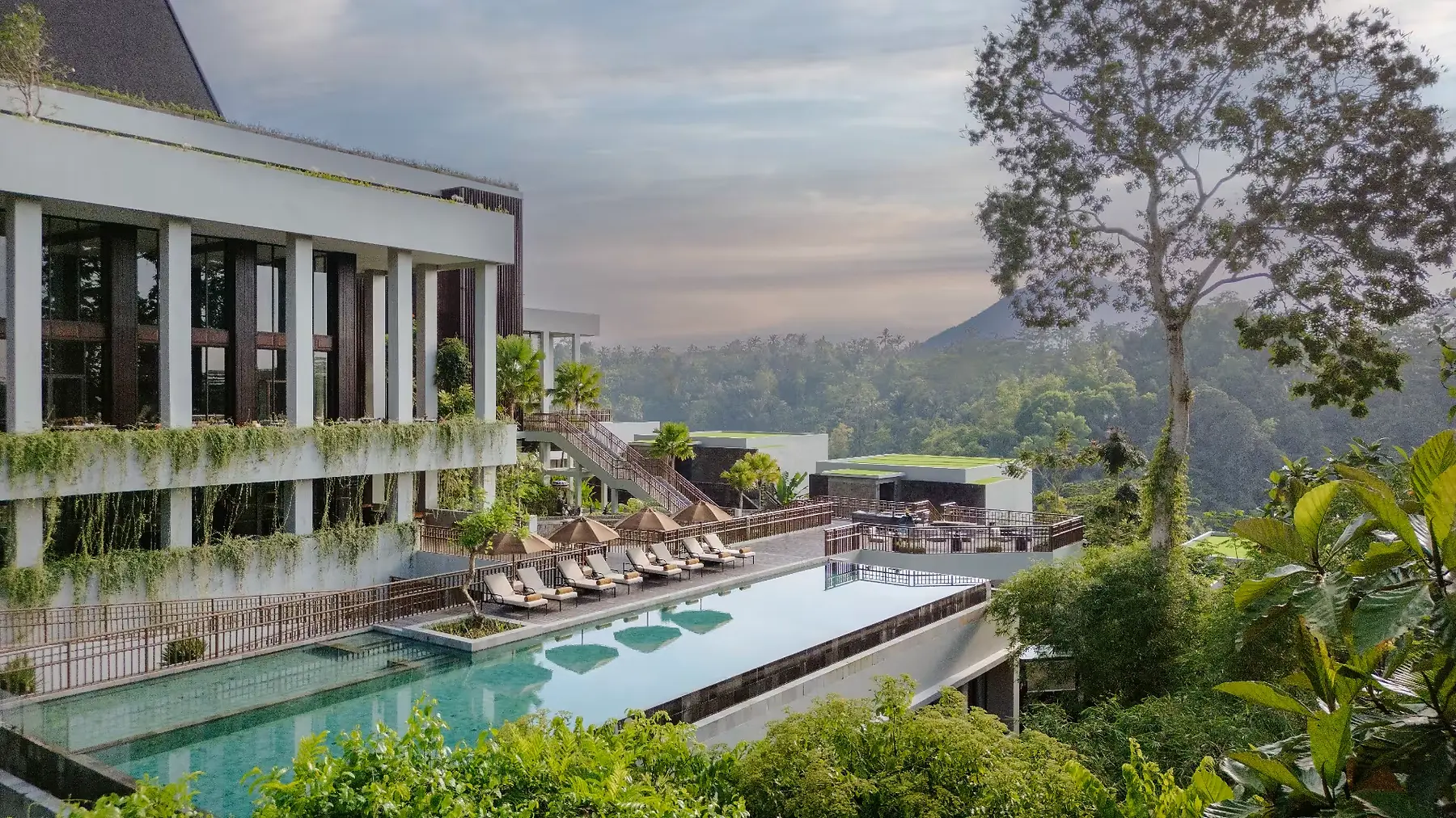 The pool terrace at Anantara Ubud, built into the valley wall