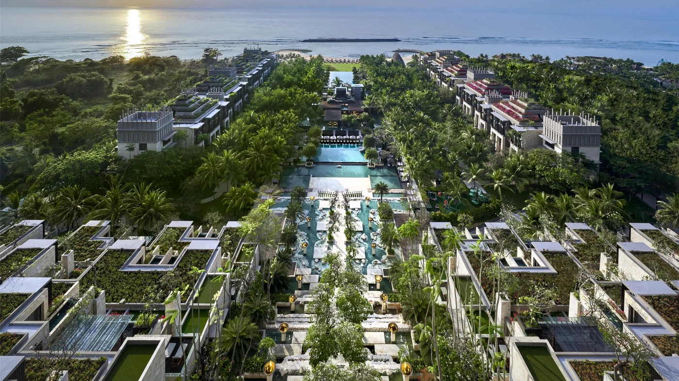 Terraced pools at The Apurva Kempinski Bali cascading through the resort down toward the Indian Ocean