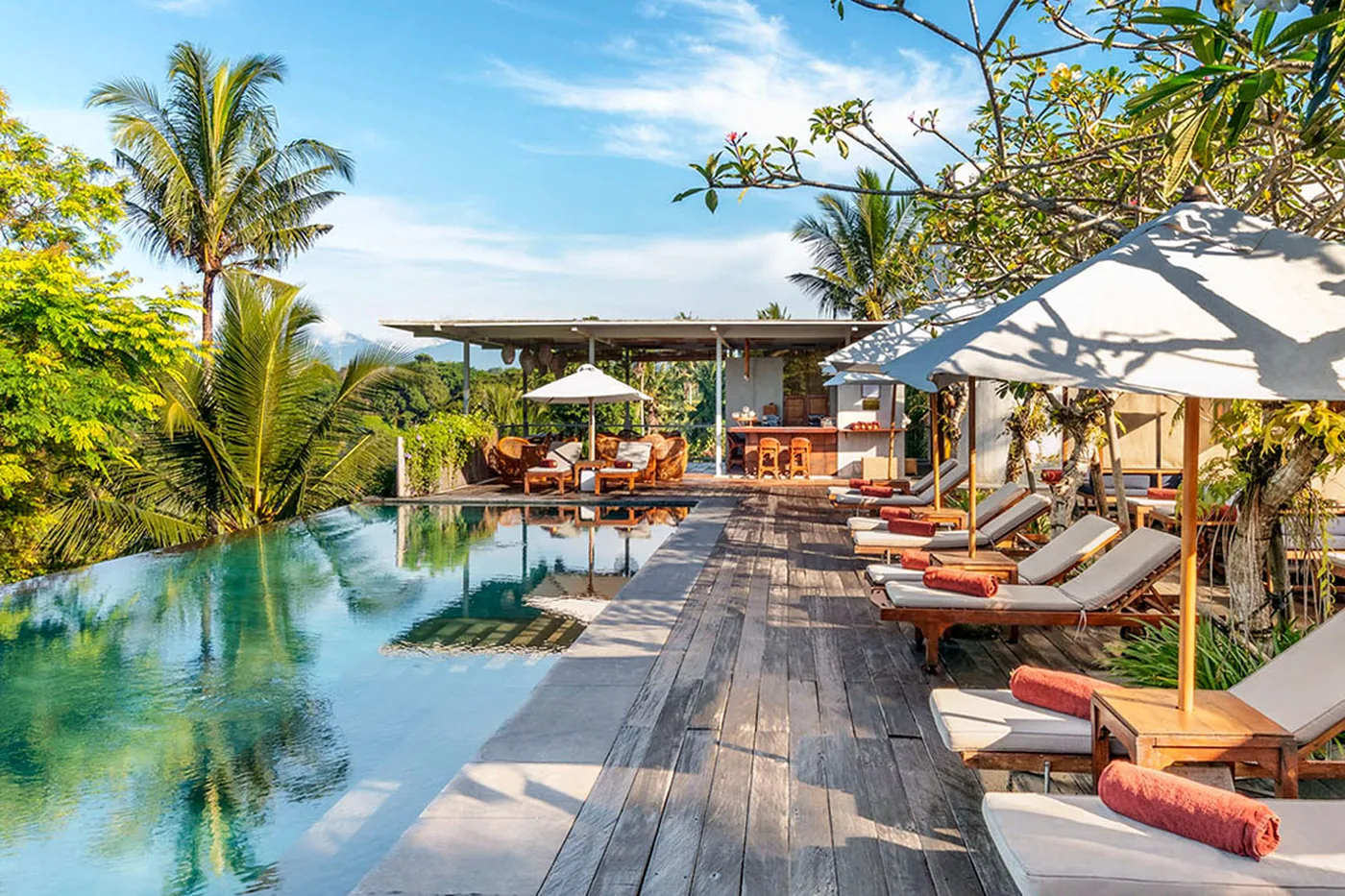 The cantilevered infinity pool and deck at Bisma Eight, looking into the Campuhan valley