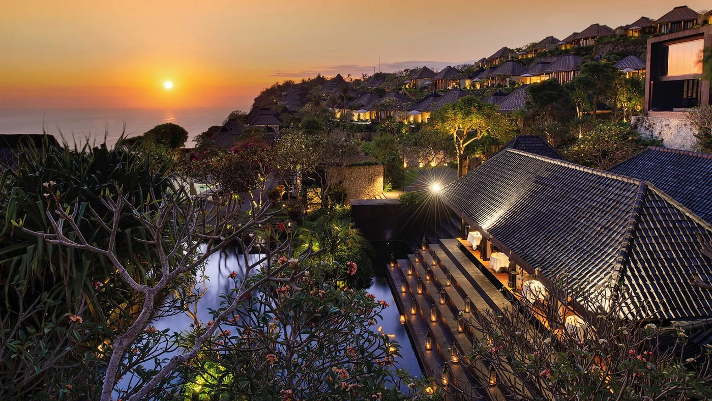 An aerial view at dusk of Bvlgari Resort Bali's villas across the Bukit Peninsula hillside