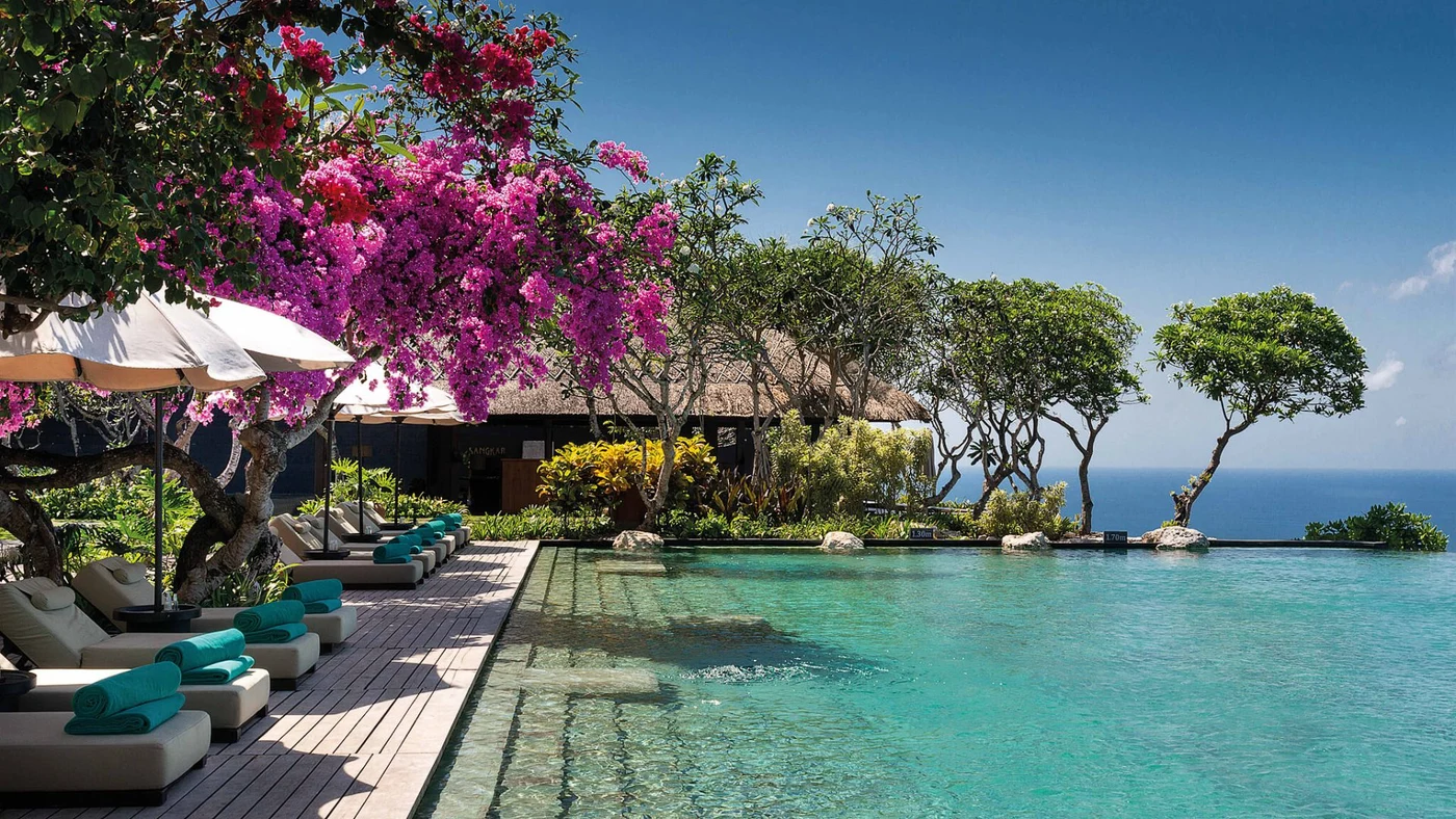 Bougainvillea over the pool deck at Sangkar, Bvlgari Resort Bali's all-day cliff-edge restaurant