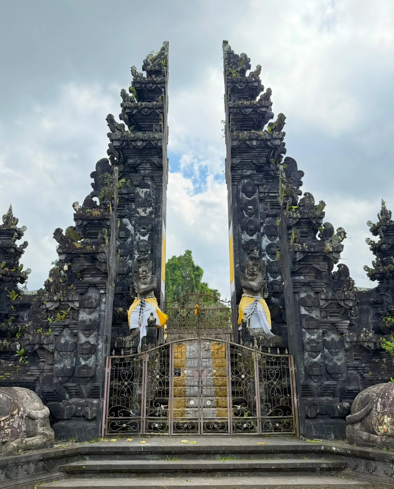 A split temple gate against a heavy sky in Bali