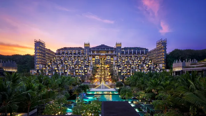 The Apurva Kempinski Bali at dusk, the Grand Staircase and pools cascading through the resort