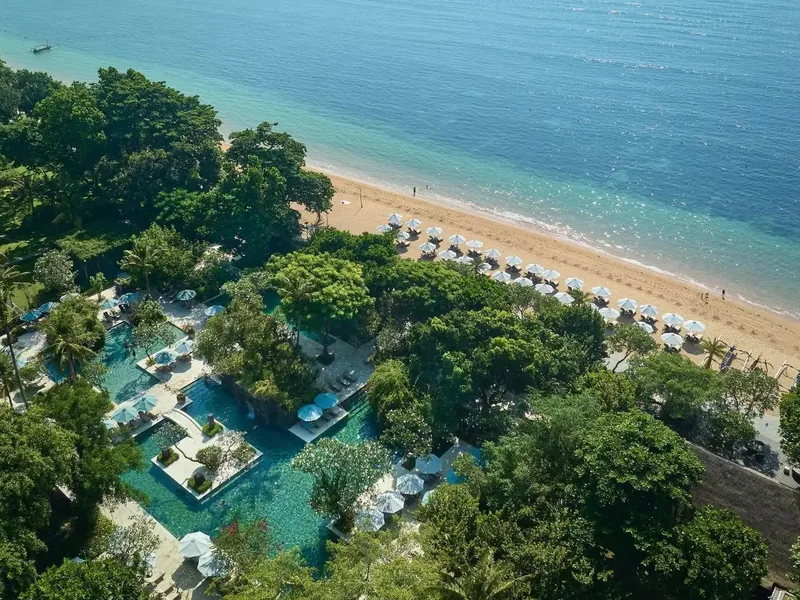 An aerial view of Hyatt Regency Bali in Sanur, showing the dense garden, pools, and 500 metres of beachfront