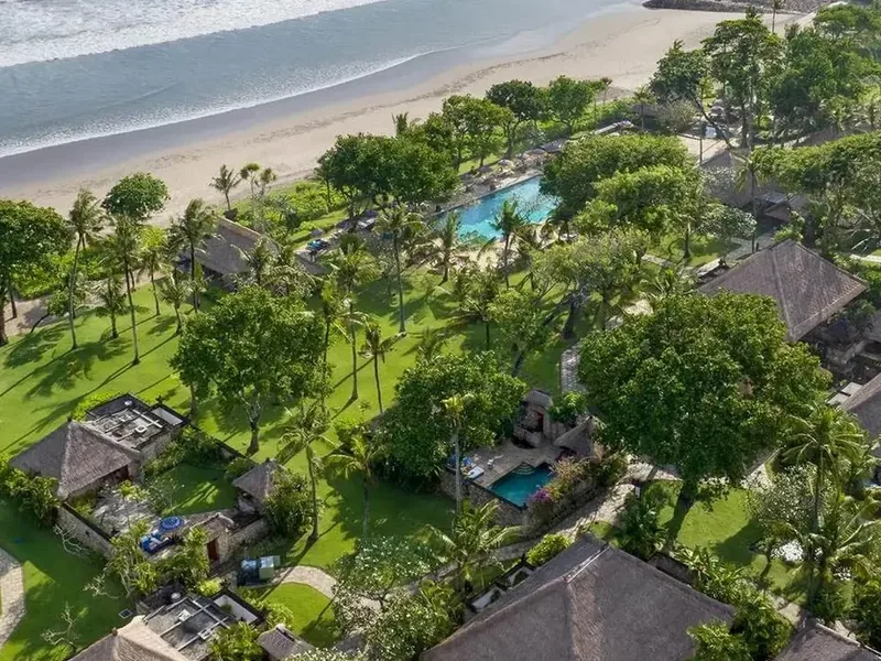Aerial view of The Oberoi Bali's beachfront gardens and villas