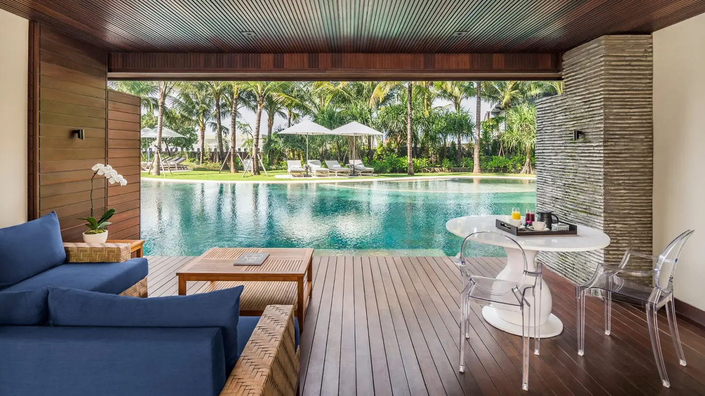 A residence terrace at COMO Uma Canggu, opening onto the lagoon pool and gardens