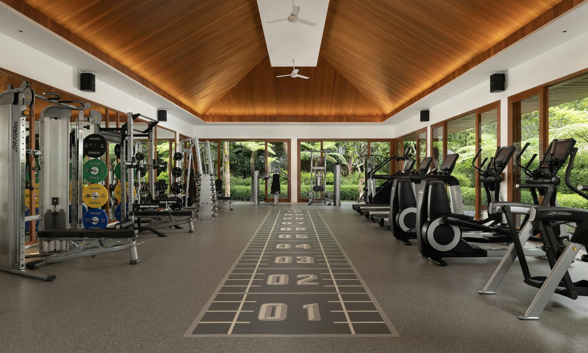 Sleek fitness centre at Como Uma Ubud, overlooking the jungle