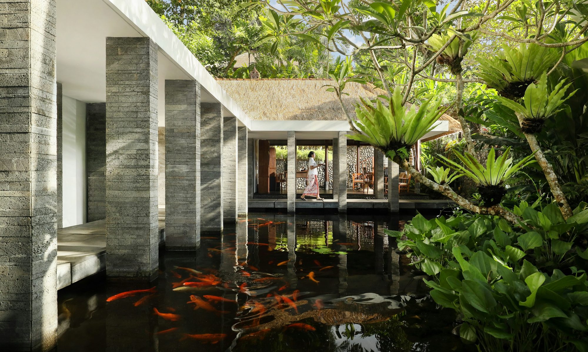 Koi pond walkway at Como Uma Ubud's reception