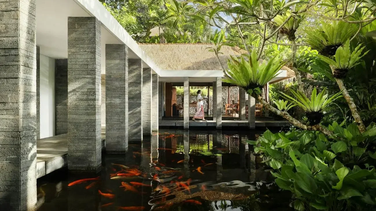 Koi pond walkway at Como Uma Ubud's reception