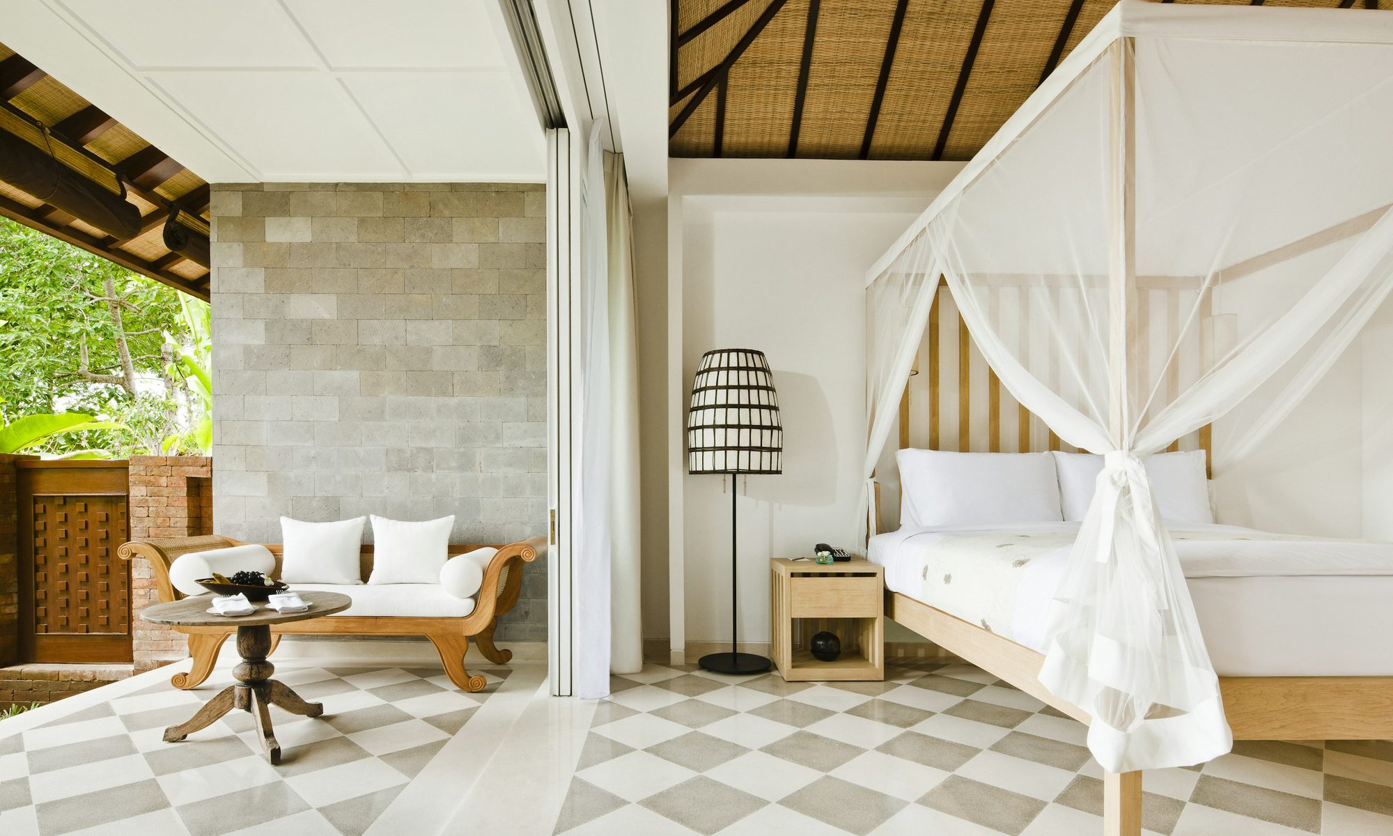 Minimalist canopy bed suite at Como Uma Ubud, designed by Koichiro Ikebuchi