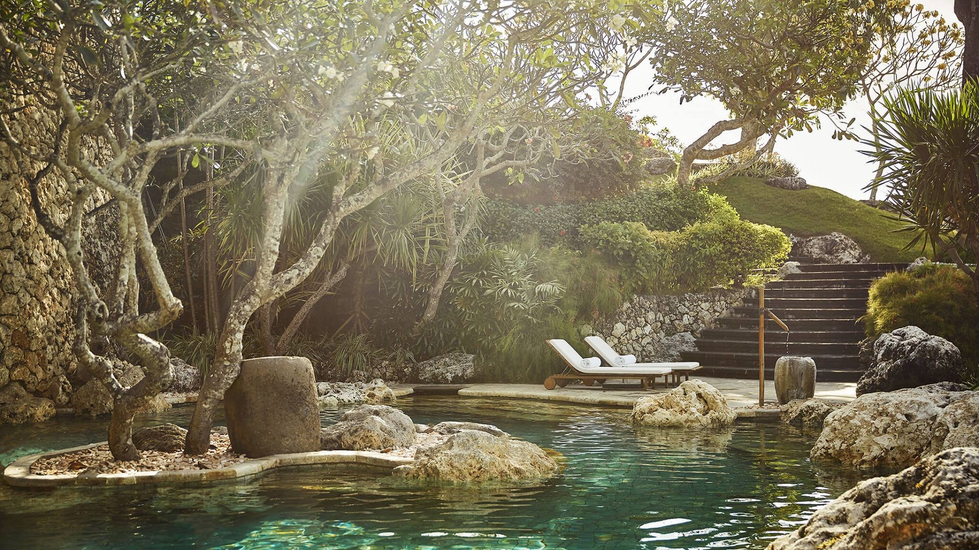 A natural rock pool in the gardens of the Healing Village Spa at Four Seasons Resort Bali at Jimbaran Bay