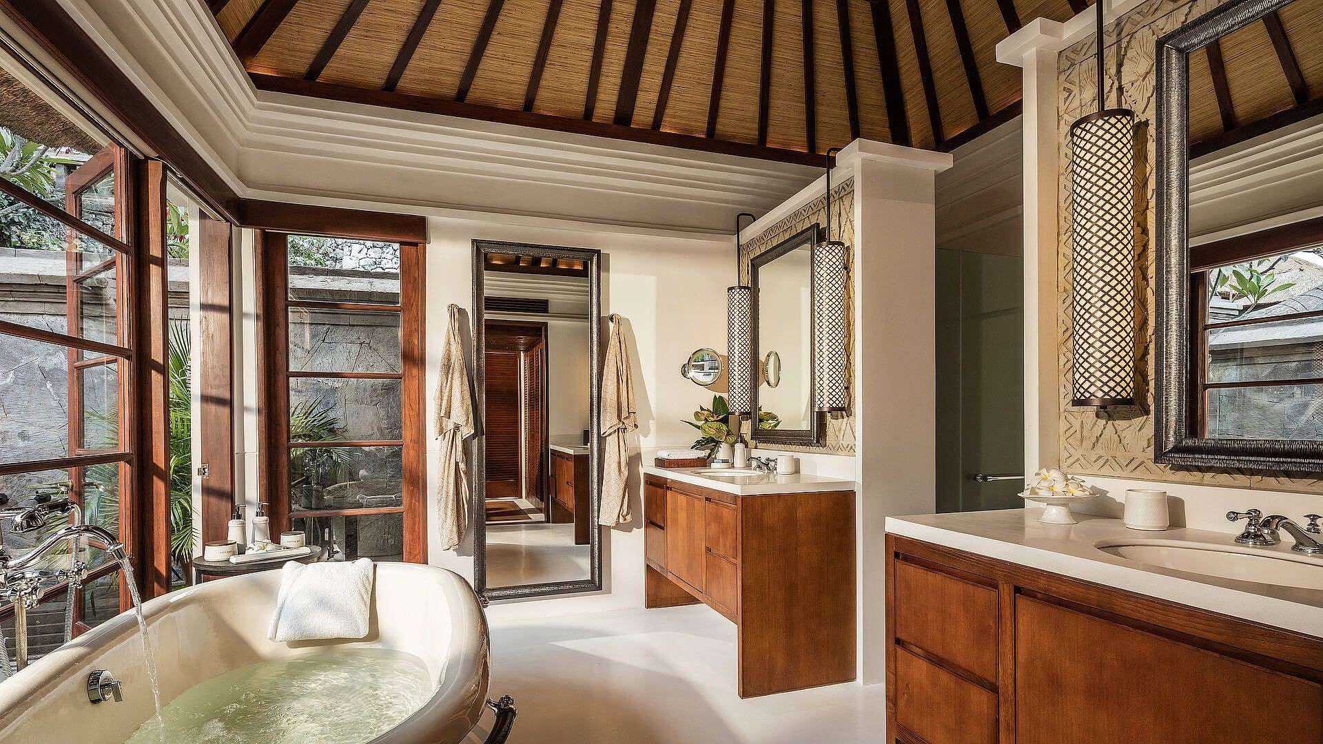A villa bathroom with a freestanding soaking tub at Four Seasons Resort Bali at Jimbaran Bay