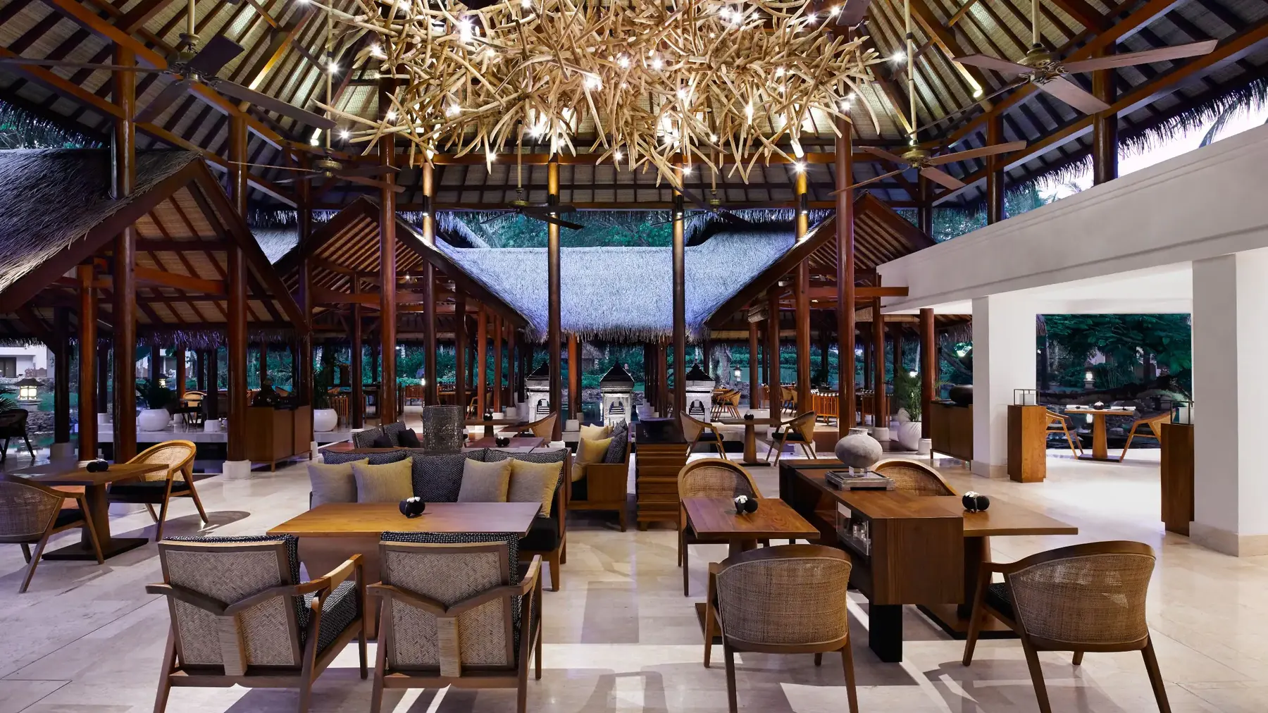 The Grand Club at Grand Hyatt Bali, an open thatched pavilion set among the ponds