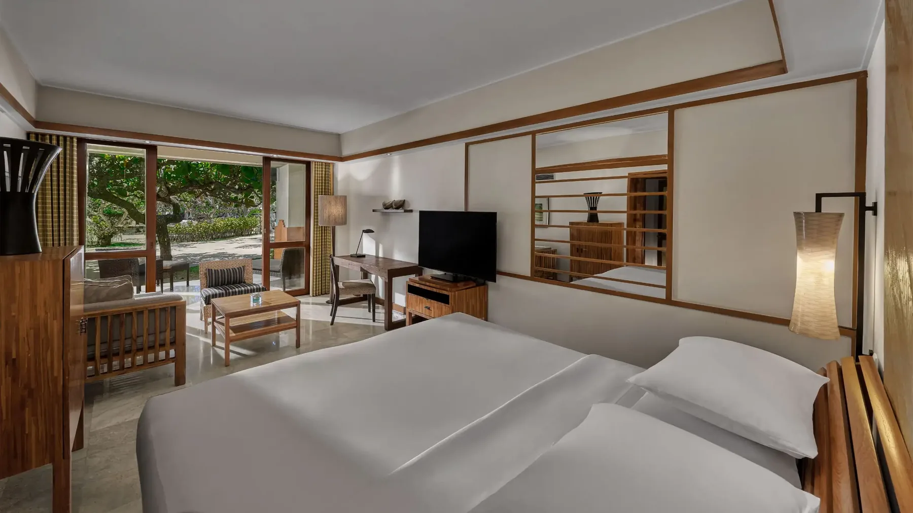 A room at Grand Hyatt Bali opening onto the gardens