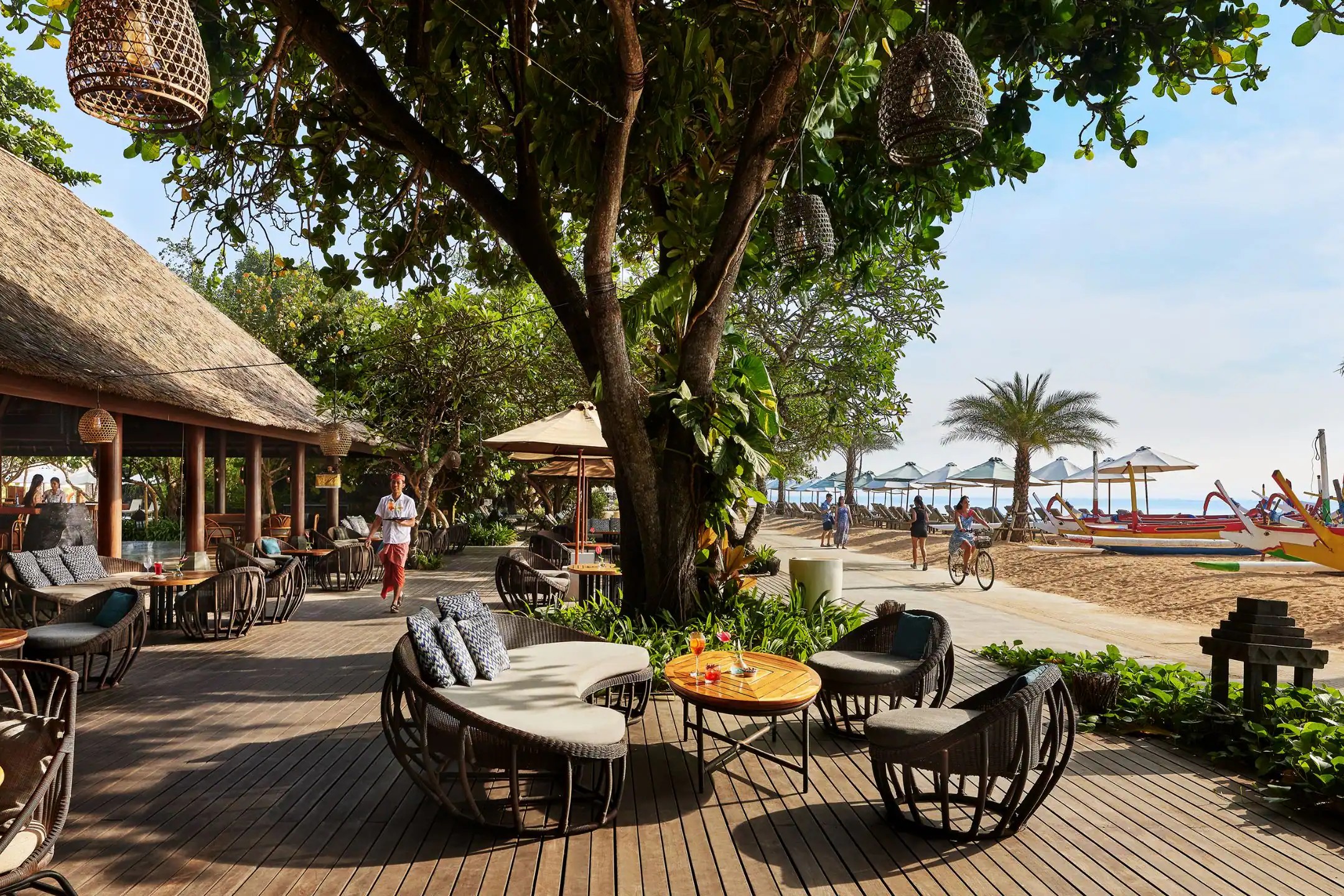 Pizzaria, the beachfront restaurant at Hyatt Regency Bali, with tables set along the sand