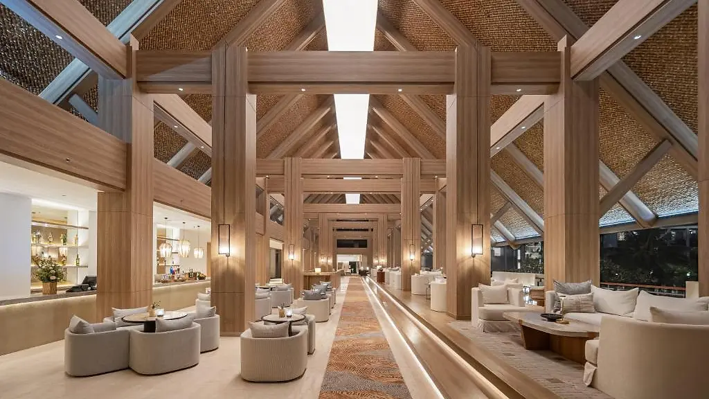 The lobby at InterContinental Bali Sanur, a light-filled hall with a pitched wooden ceiling