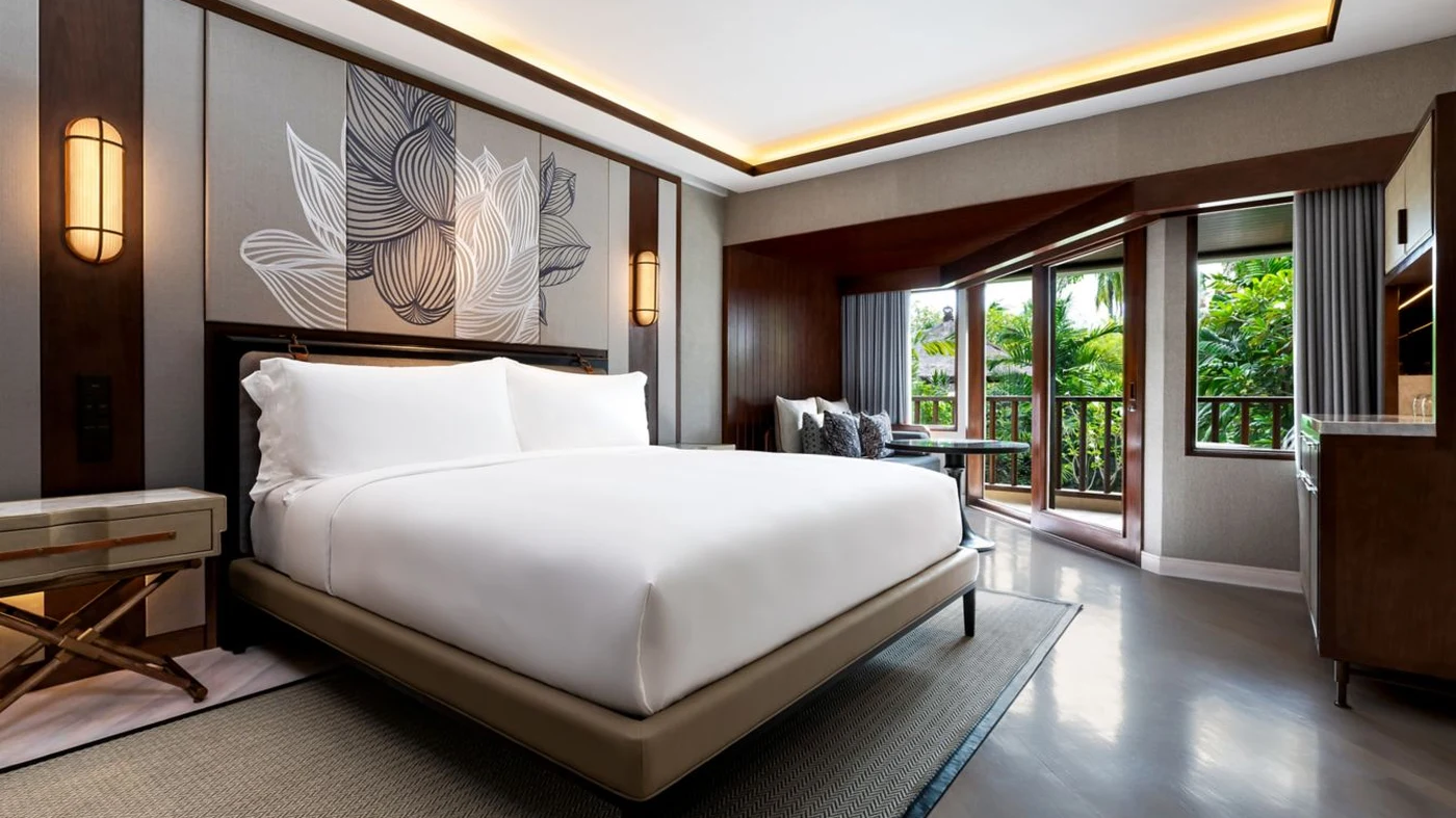 A renovated room at The Laguna, with its signature lotus embroidery headboard