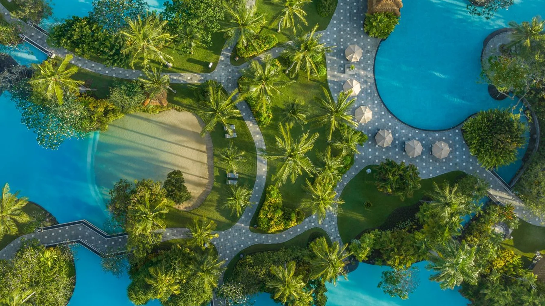Aerial view of The Laguna's seven lagoon pools winding through the gardens