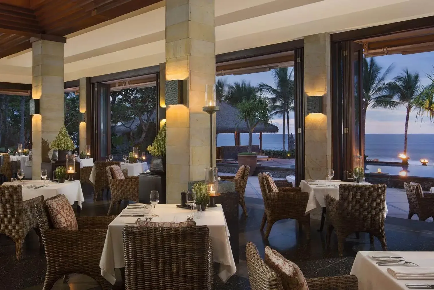 The restaurant terrace at The Legian Seminyak at dusk