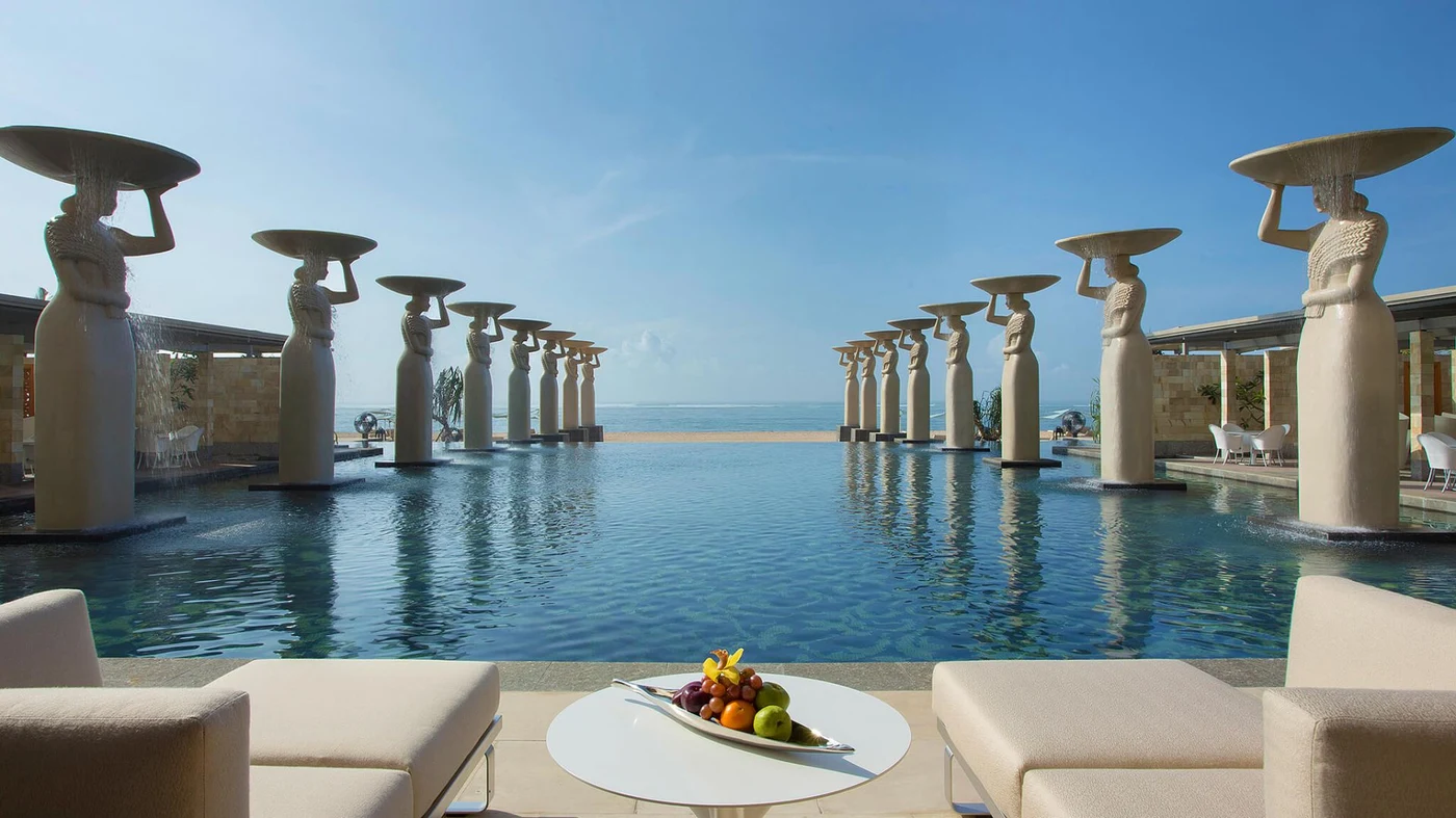 The metres-high statues lining the Oasis Pool at The Mulia