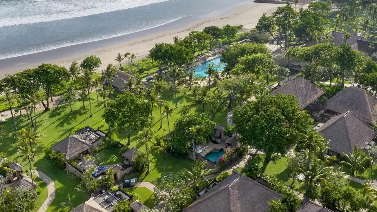 Aerial view of The Oberoi Bali's beachfront gardens and villas