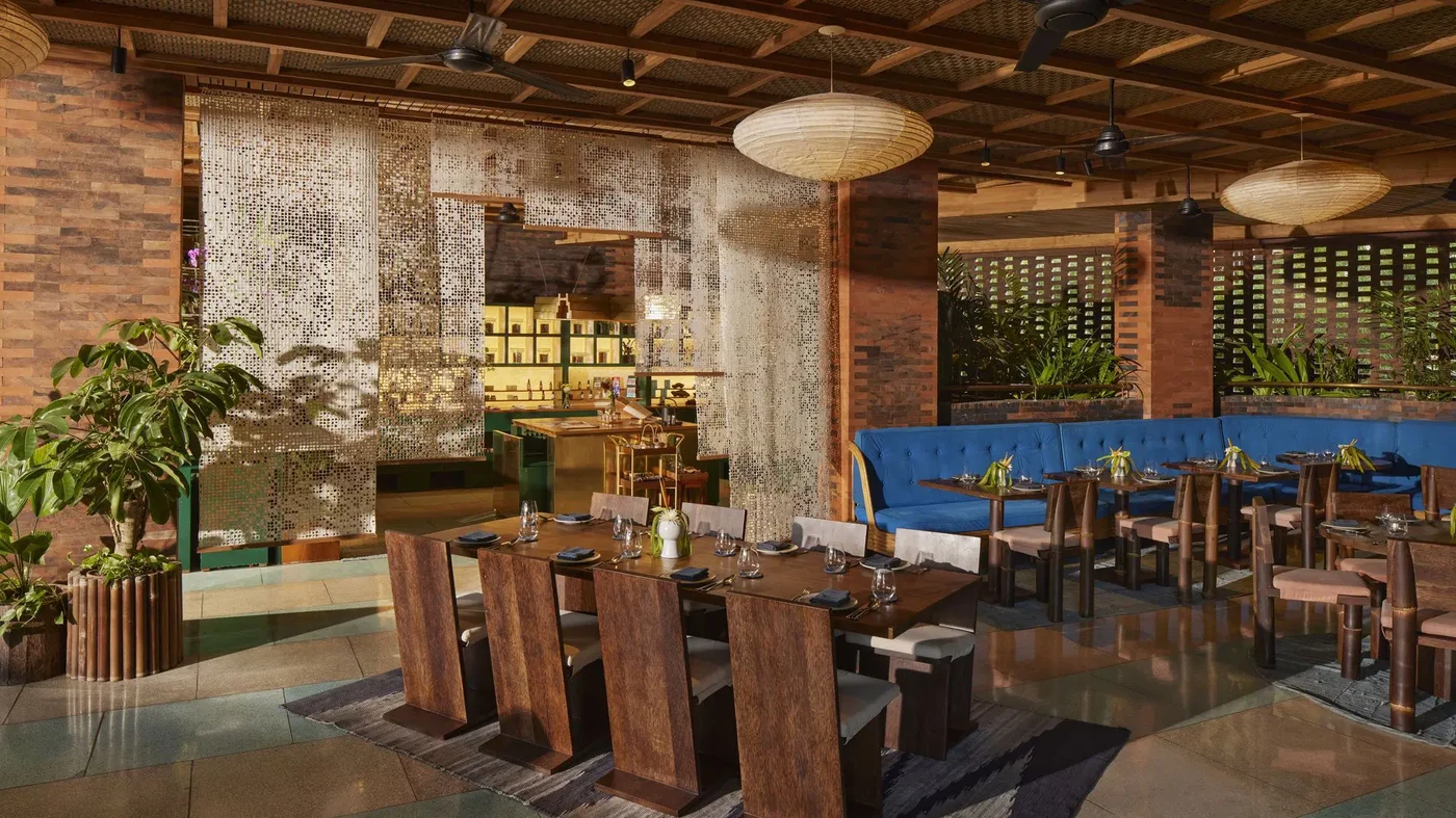 A long communal table at one of Desa Potato Head's restaurants