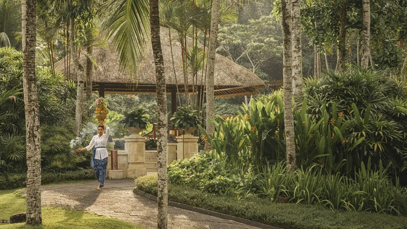 Morning offerings being carried through the grounds at Four Seasons Resort Bali at Sayan