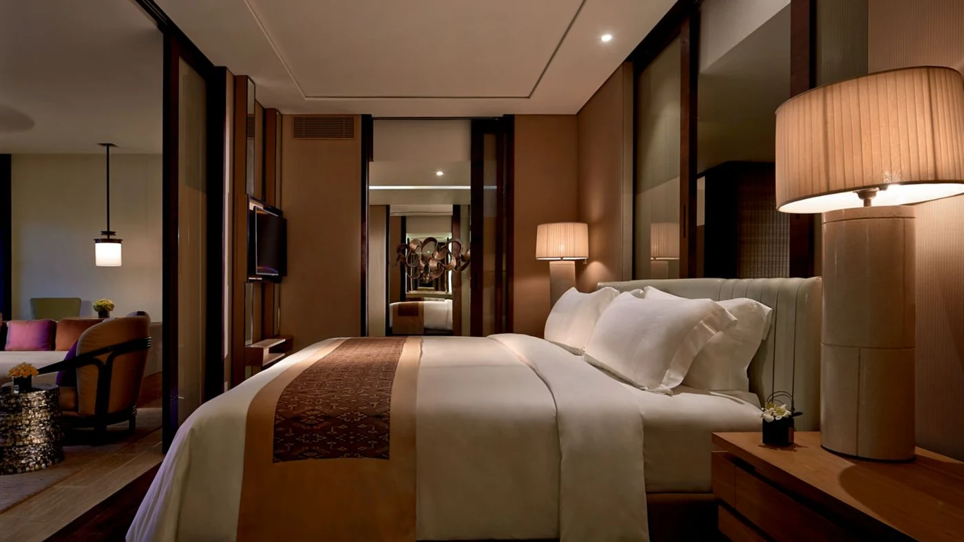 A Sawangan Junior Suite bedroom at The Ritz-Carlton, Bali
