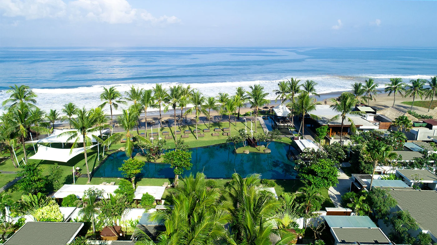 Aerial view of The Samaya Seminyak, garden, lagoon pool and beach in one line