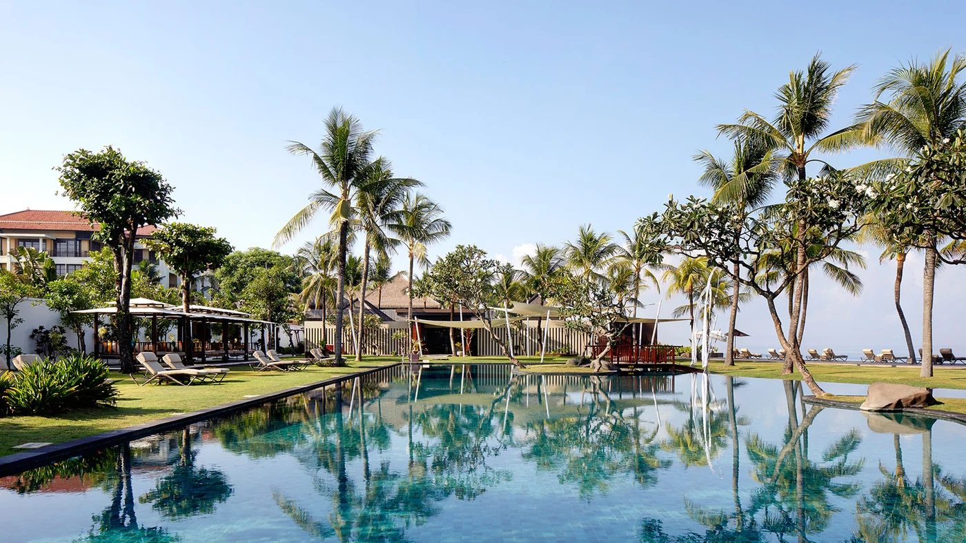 The pool at The Samaya in Seminyak, with the sea beyond