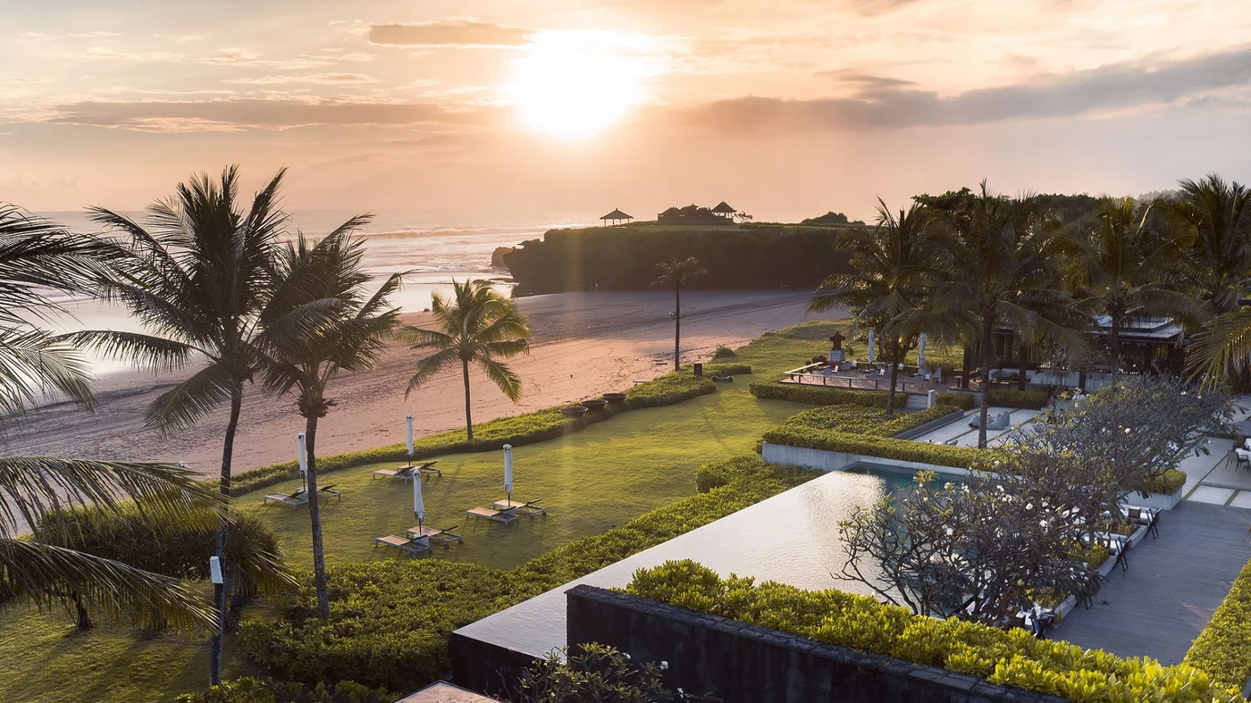 Soori Bali at dusk, the pool, beach and cliff pavilions beyond