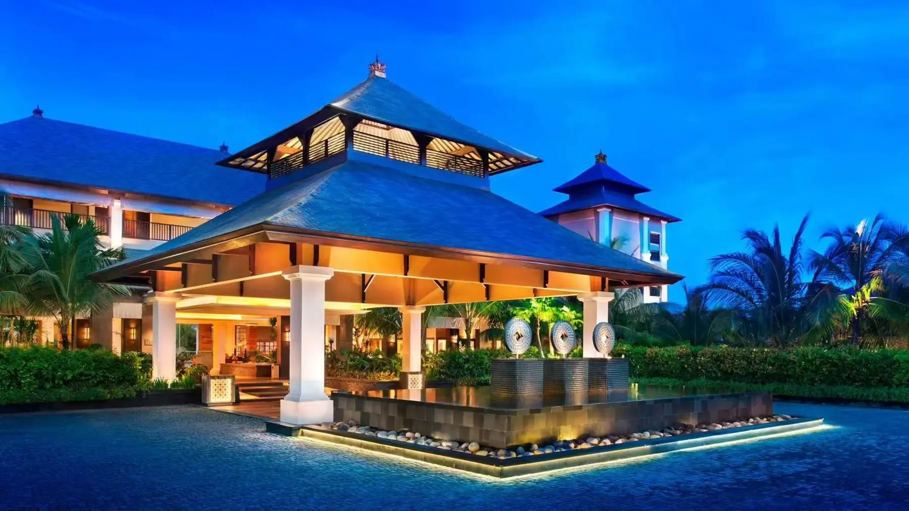 The St. Regis Bali Resort's entrance pavilion at dusk