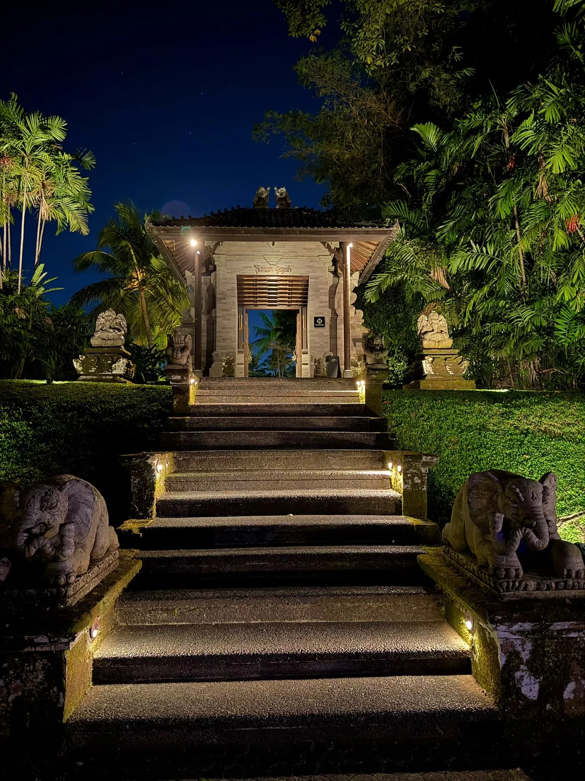 Temple steps lit at dusk in Bali