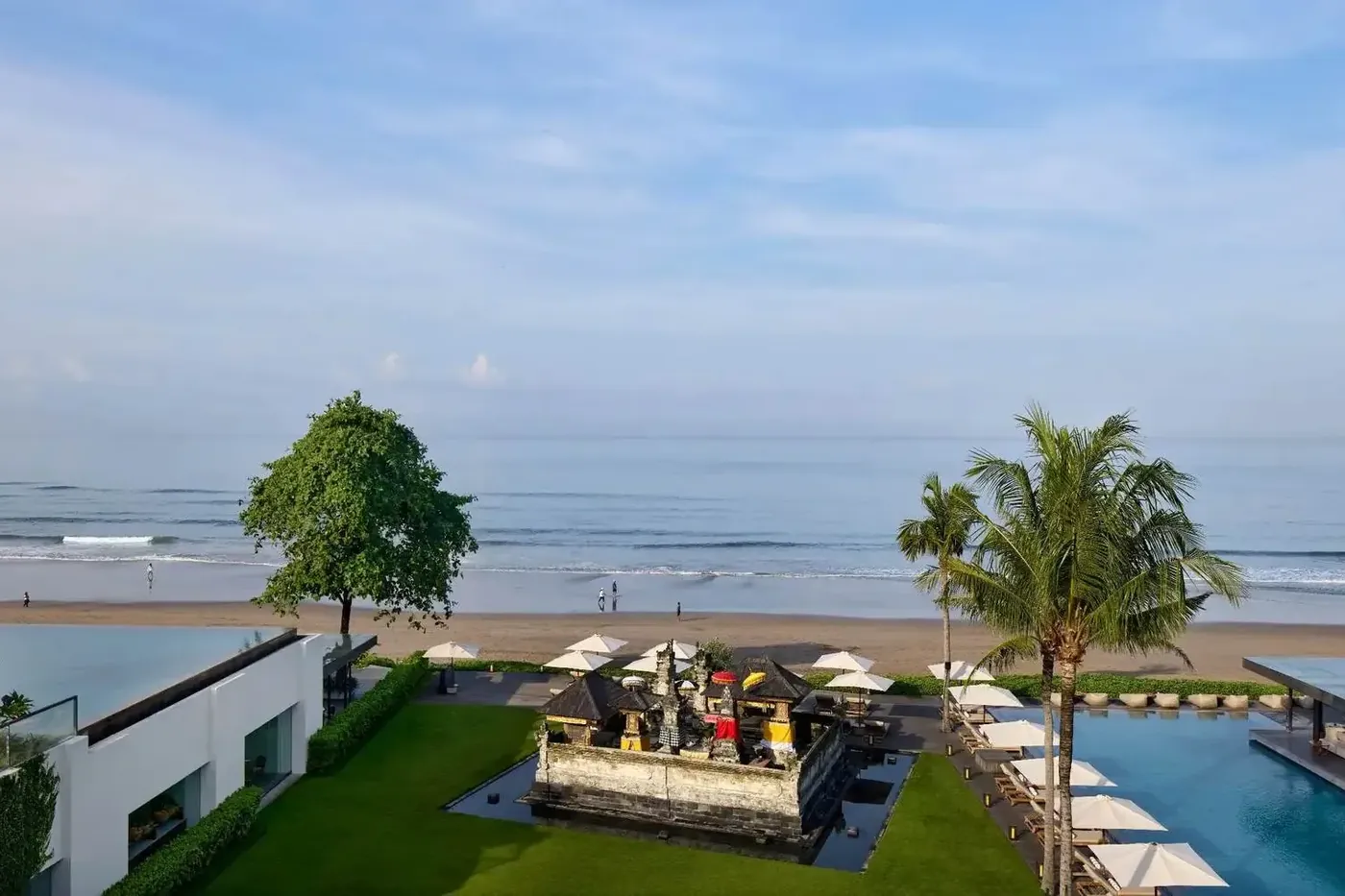 An ancestral family temple in the lawn at Alila Seminyak, between the pool and the beach