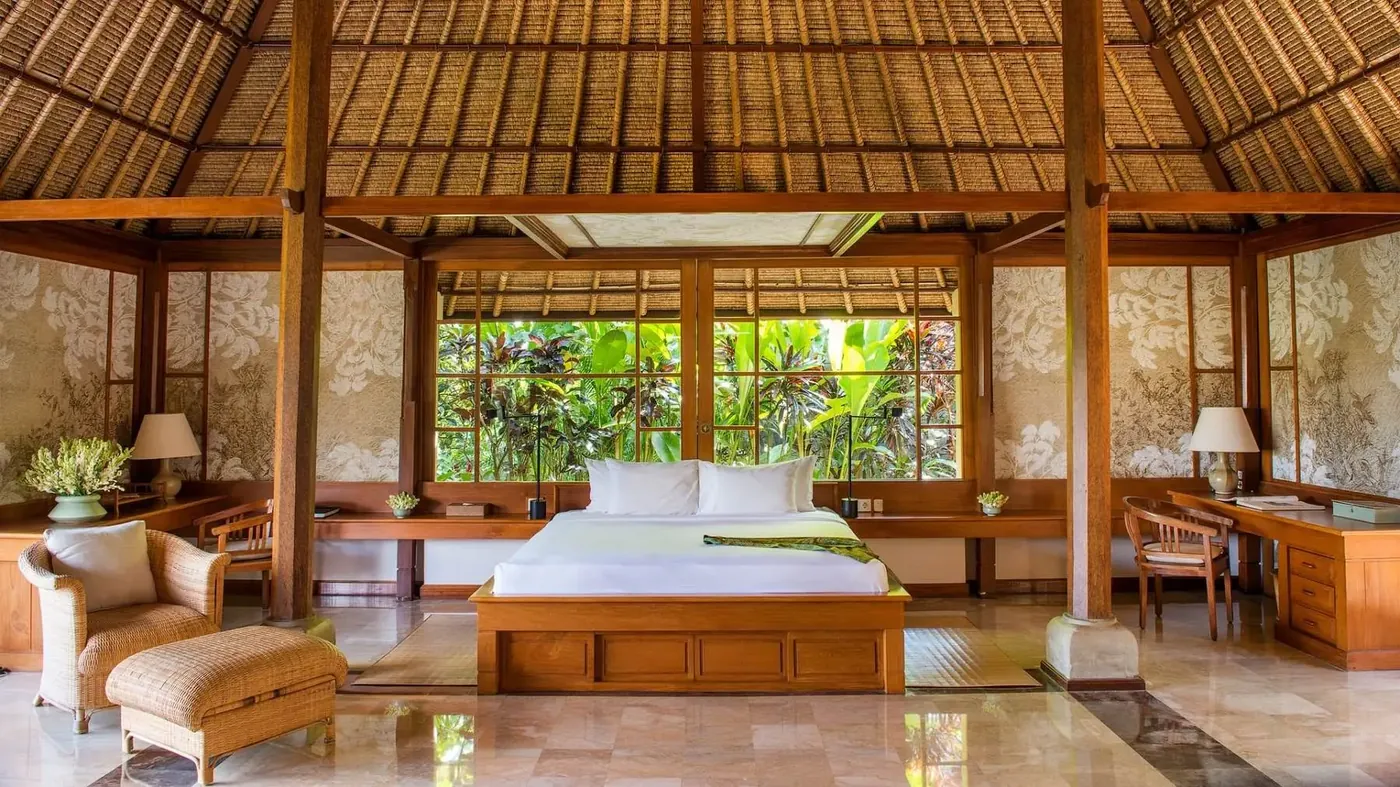 Village Suite bedroom at Amandari, opening onto a private garden