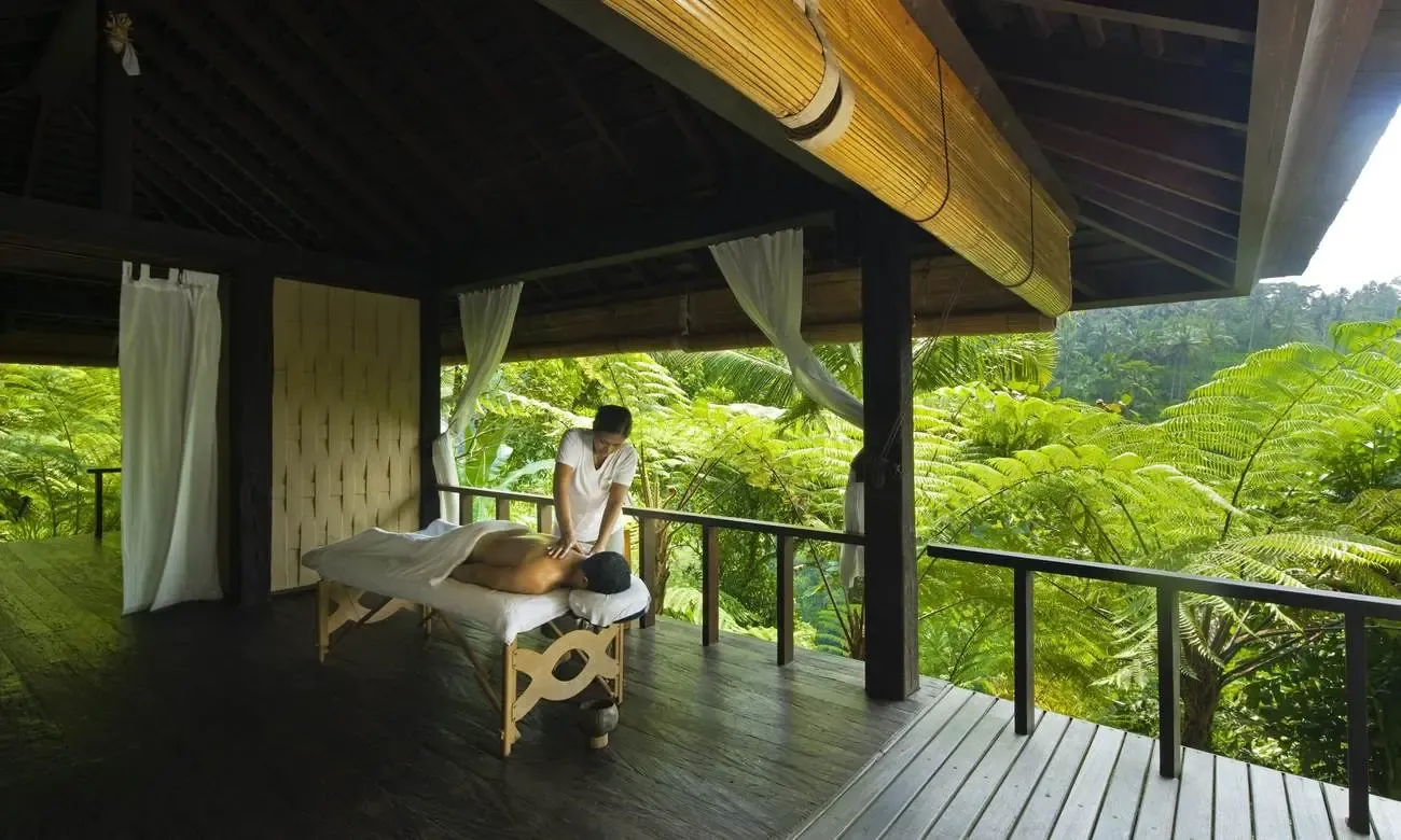 Massage treatment in an open-air pavilion overlooking the jungle at Como Shambhala Estate