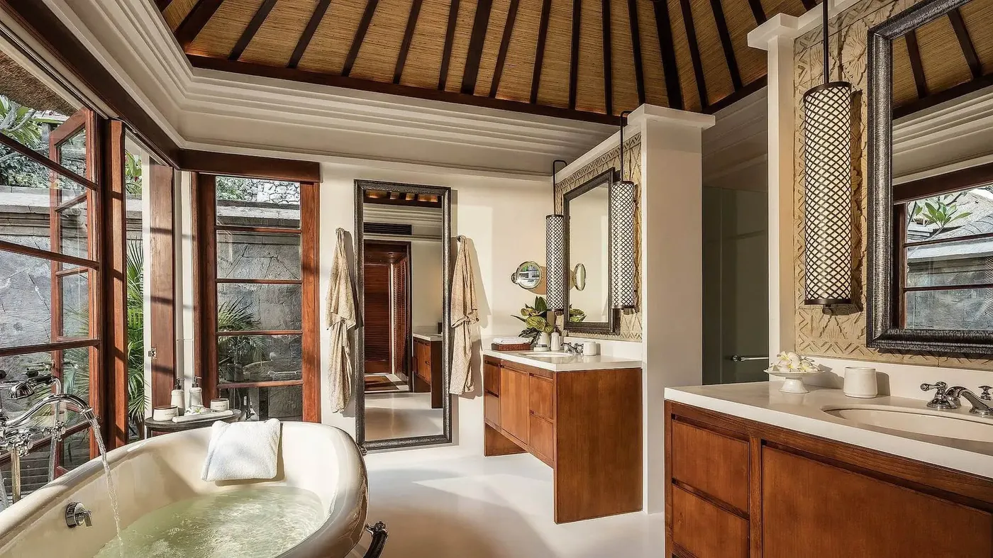 A villa bathroom with a freestanding soaking tub at Four Seasons Resort Bali at Jimbaran Bay