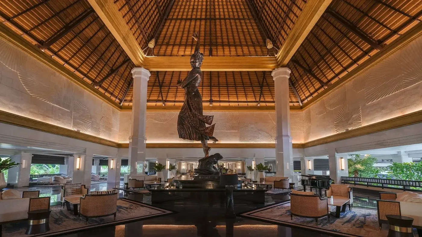 Bronze dancer statue in the open-air lobby at InterContinental Bali Resort