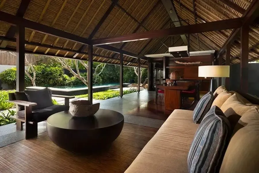 The open-air living pavilion of a villa at Kayumanis Jimbaran, overlooking the private pool