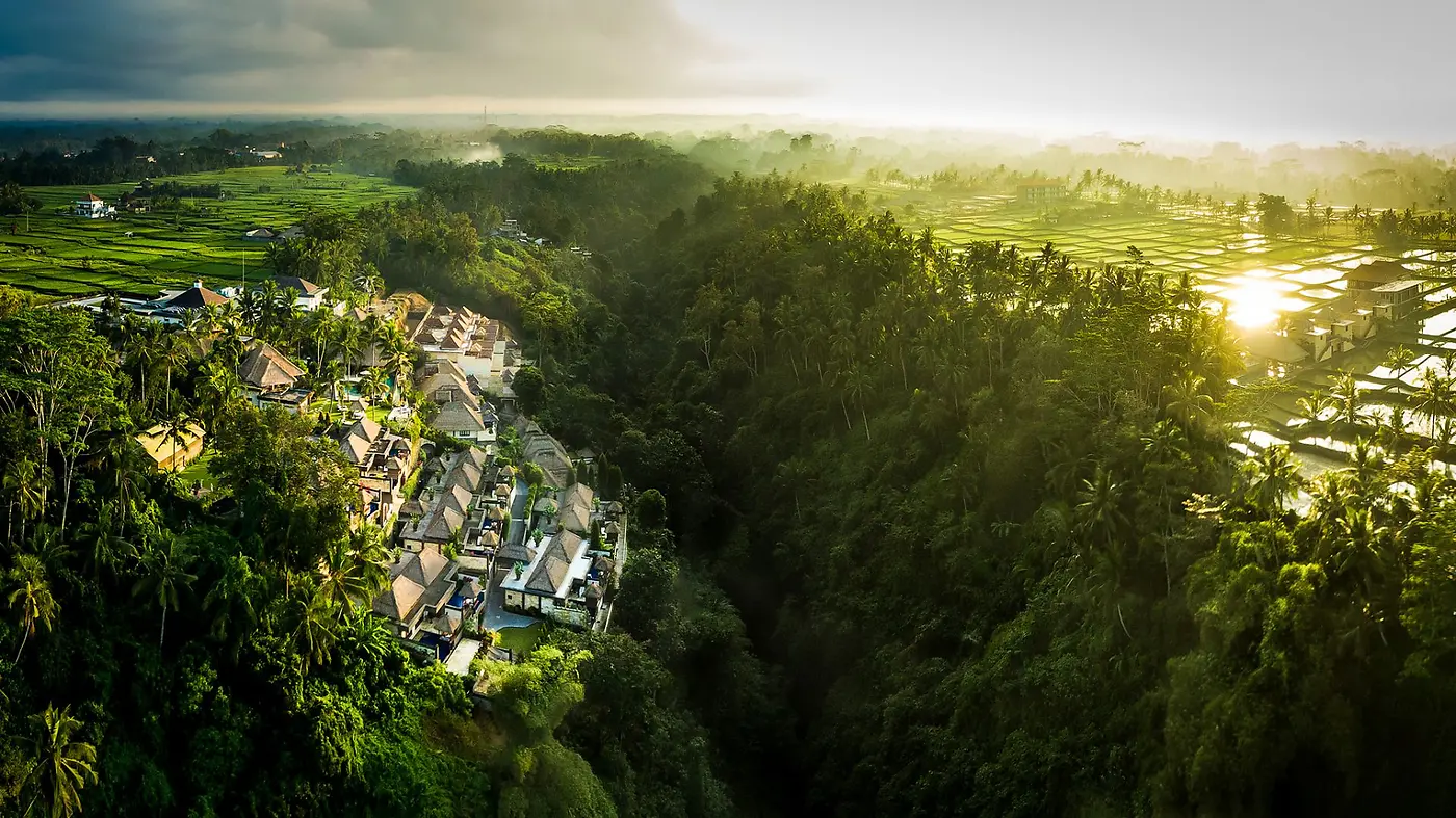 Viceroy Bali's villas strung along the edge of the gorge, jungle canyon dropping away in dramatic light