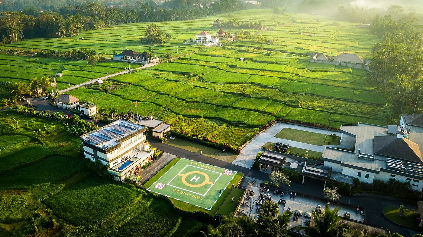 Aerial view of Viceroy Bali's helipad set among rice fields, built when the plan was to be reachable by the very rich
