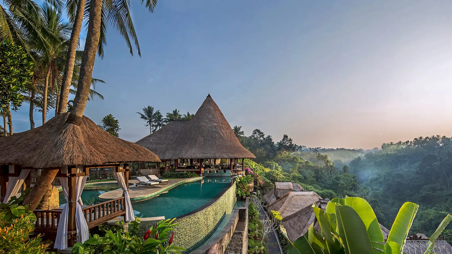 Thatched pool pavilions at Viceroy Bali, perched above the Petanu gorge