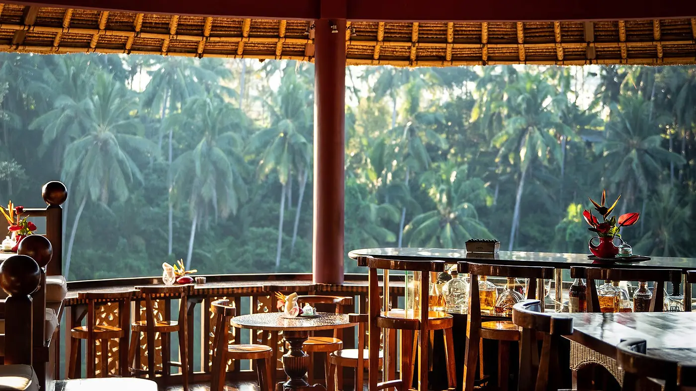 An open-air bar at Viceroy Bali overlooking the jungle canopy