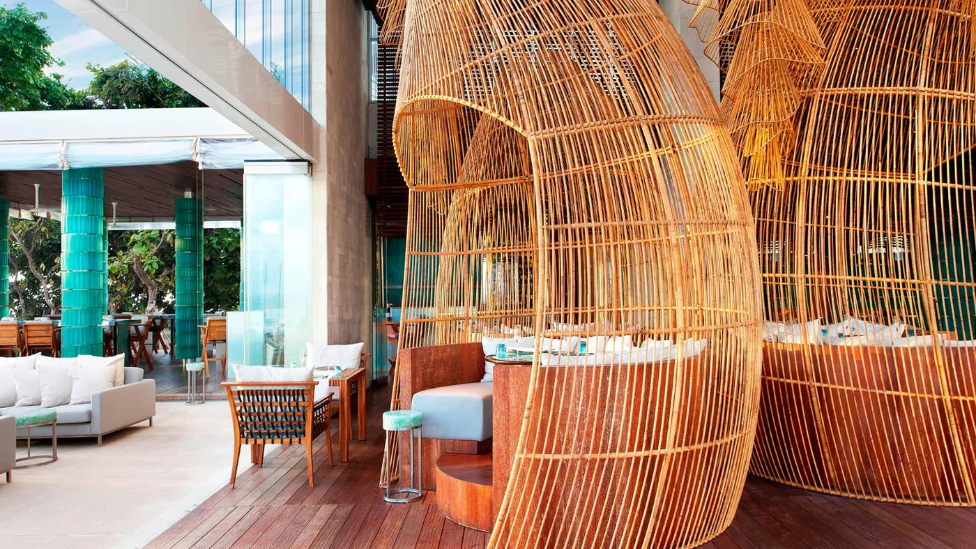 Woven fish-basket booths at Starfish Bloo, W Bali, Seminyak