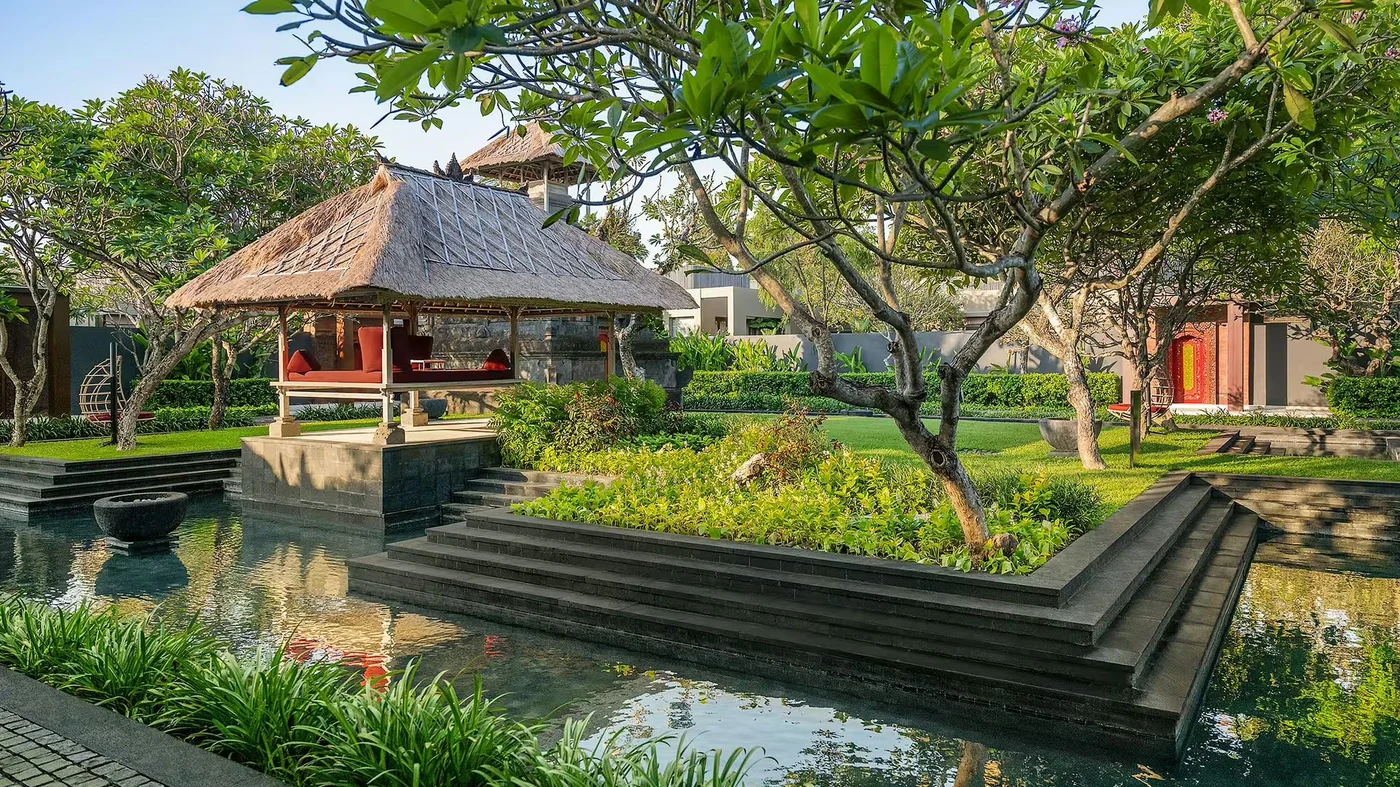 A quiet garden pavilion beside a reflecting pond at W Bali, Seminyak